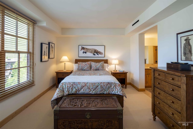 109 Angani Way Unit 15, Sun Valley, ID 83353 - bedroom with light colored carpet, multiple windows, and a tray ceiling
