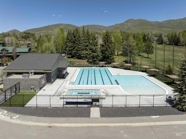 109 Angani Way Unit 15, Sun Valley, ID 83353 - community pool with a patio area, a mountain view, and a community hot tub