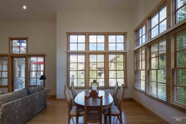109 Angani Way Unit 15, Sun Valley, ID 83353 - dining room featuring light wood-style flooring and a high ceiling