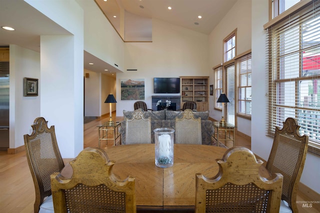 109 Angani Way Unit 15, Sun Valley, ID 83353 - dining area with wood finished floors, a high ceiling, recessed lighting, and a fireplace