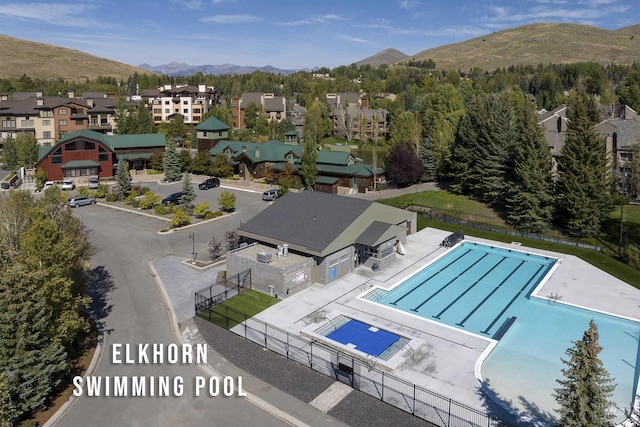 109 Angani Way Unit 15, Sun Valley, ID 83353 - aerial perspective of suburban area with mountains and a pool