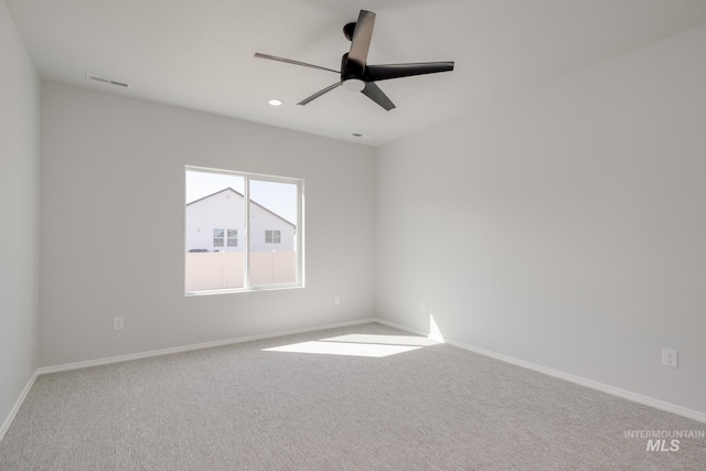 spare room with a ceiling fan, visible vents, baseboards, recessed lighting, and carpet flooring