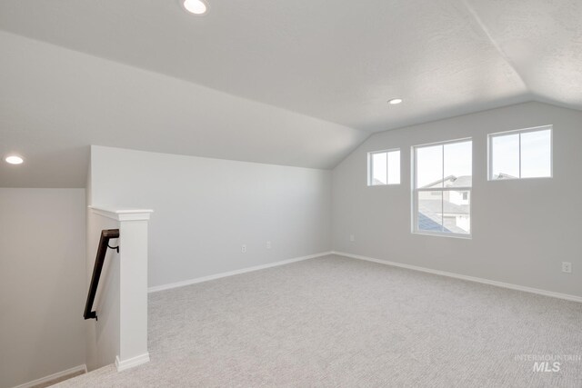 bonus room featuring recessed lighting, baseboards, and lofted ceiling