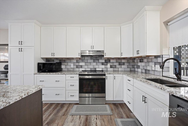 kitchen with dark wood-type flooring, sink, white cabinets, and black appliances