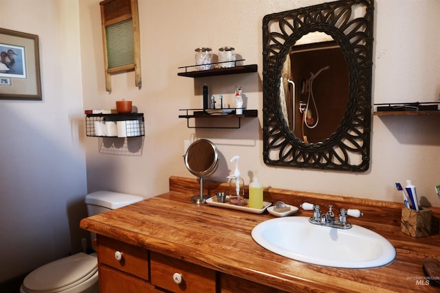 bathroom with vanity and toilet