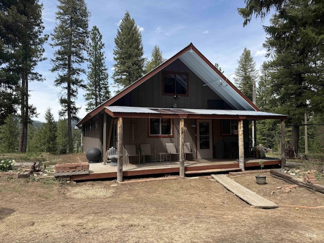26 Doaka Ct, Idaho City, ID 83631 - rear view of property with board and batten siding and covered porch
