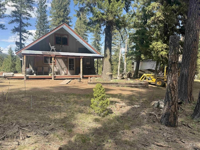 26 Doaka Ct, Idaho City, ID 83631 - back of house featuring covered porch and board and batten siding