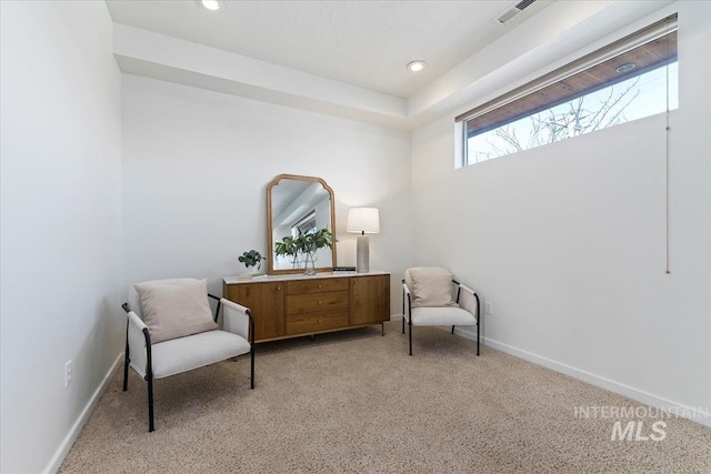 living area featuring recessed lighting, light carpet, visible vents, and baseboards