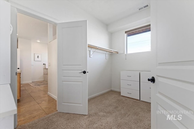 walk in closet featuring visible vents