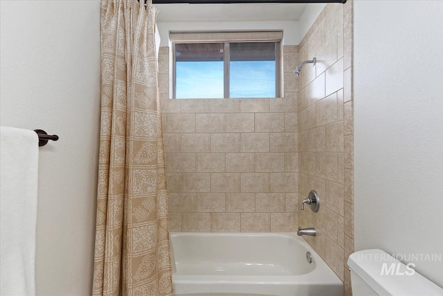 full bathroom featuring toilet and shower / tub combo