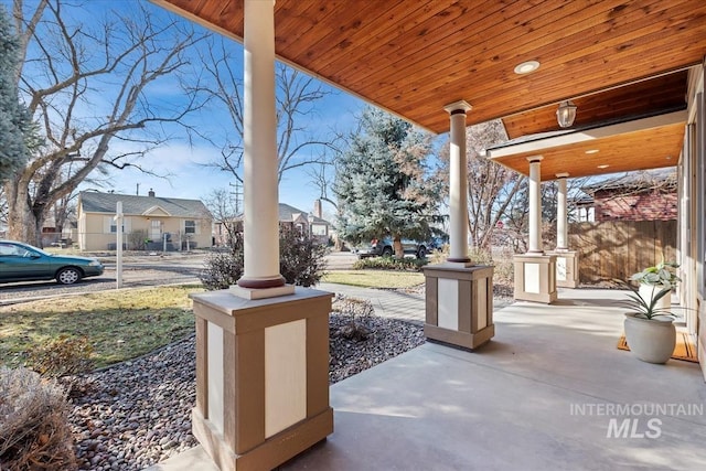 view of patio / terrace featuring a porch and a residential view