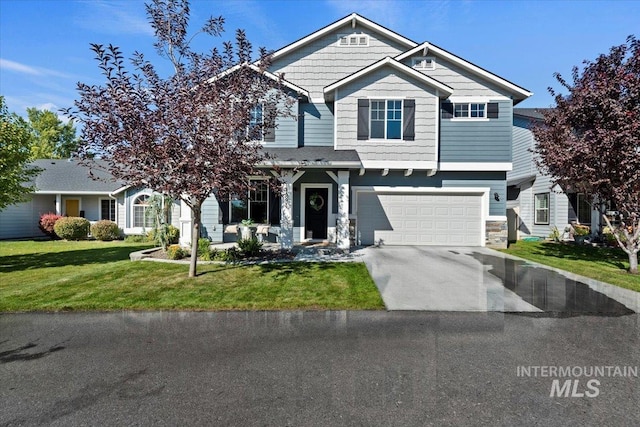 view of front of property with a front yard and a garage