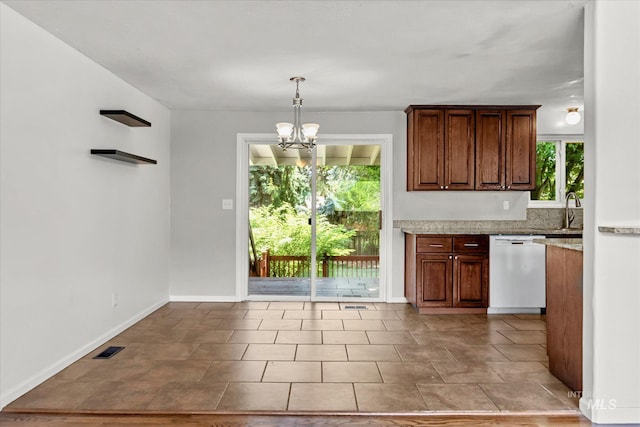 7313 W Court Ave, Boise, ID 83704 - kitchen featuring white dishwasher, a chandelier, pendant lighting, a sink, and baseboards