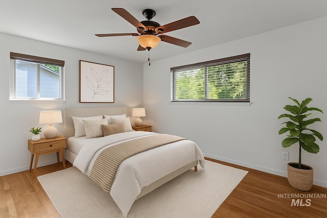 7313 W Court Ave, Boise, ID 83704 - bedroom with light wood-style floors, baseboards, and ceiling fan