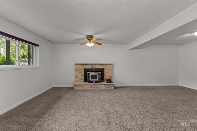 7313 W Court Ave, Boise, ID 83704 - unfurnished living room featuring a ceiling fan, carpet floors, and baseboards