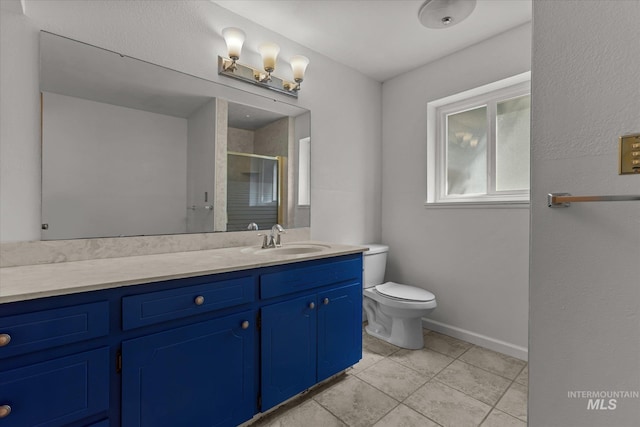 7313 W Court Ave, Boise, ID 83704 - full bathroom featuring vanity, tile patterned flooring, a shower stall, toilet, and baseboards