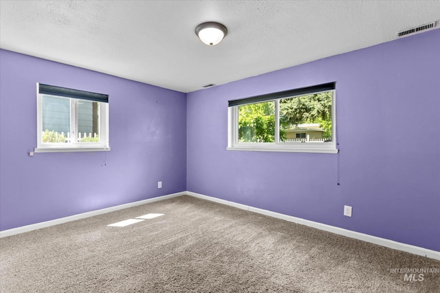 7313 W Court Ave, Boise, ID 83704 - carpeted spare room featuring a textured ceiling and baseboards