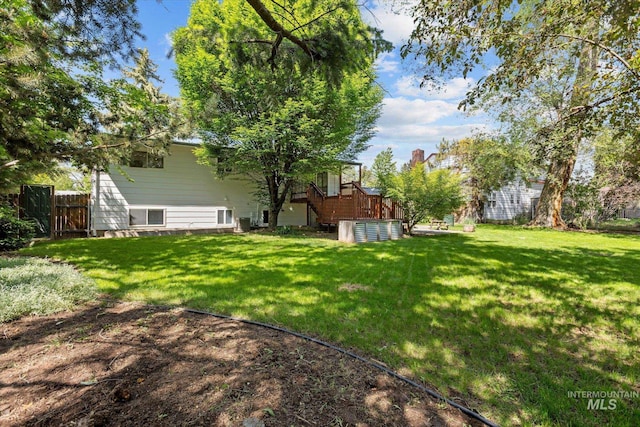 7313 W Court Ave, Boise, ID 83704 - view of yard featuring a deck