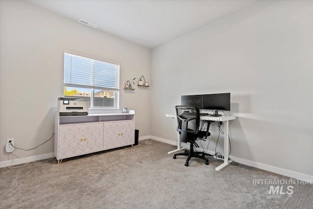 office featuring baseboards, visible vents, and carpet floors