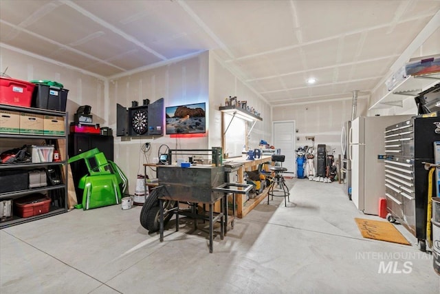 garage with a workshop area