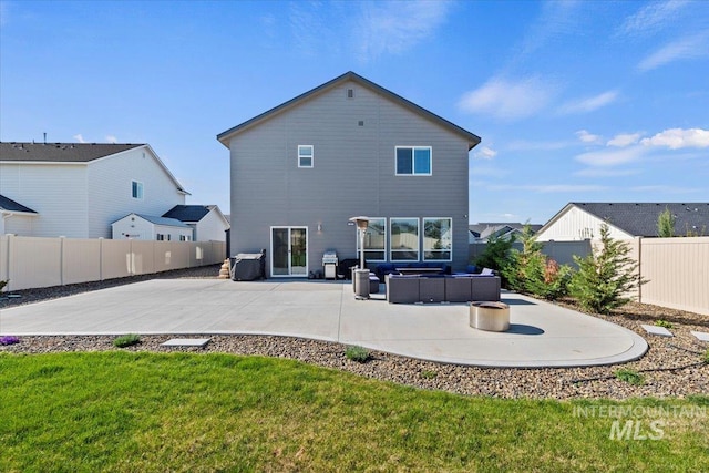 back of house with a yard, a patio, an outdoor living space, and a fenced backyard