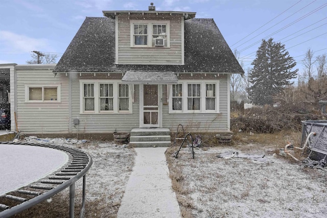 view of front of property with a trampoline