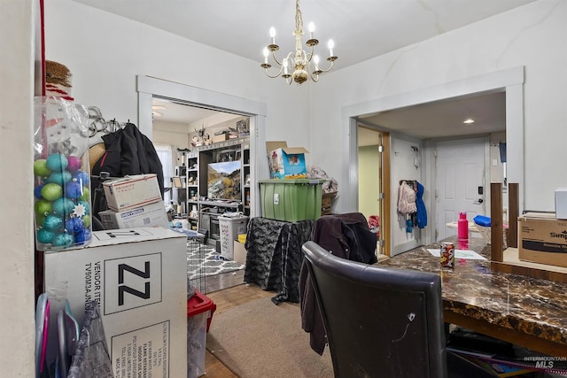 office area featuring a chandelier and hardwood / wood-style floors