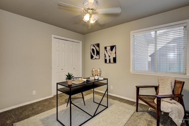 office space featuring carpet flooring, baseboards, and ceiling fan