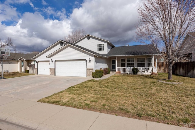 view of front of property featuring brick siding, a front lawn, a porch, driveway, and an attached garage