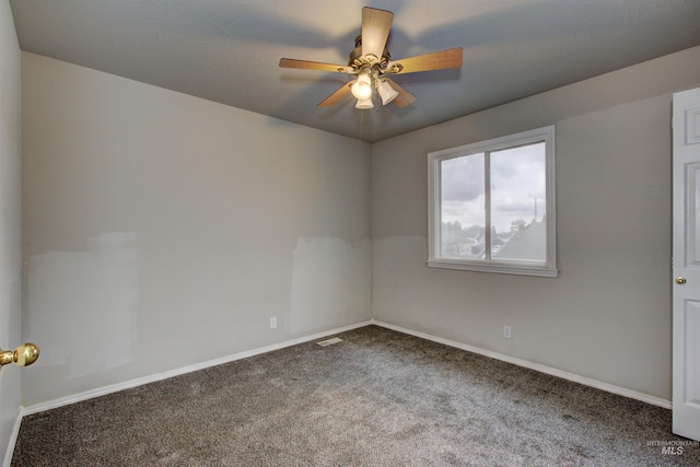 unfurnished room featuring visible vents, ceiling fan, baseboards, and carpet