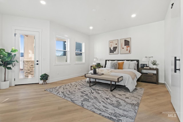 bedroom with light hardwood / wood-style floors