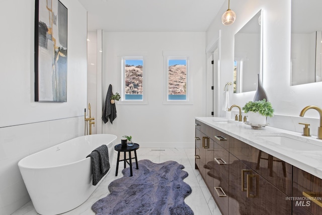 bathroom featuring a washtub and vanity