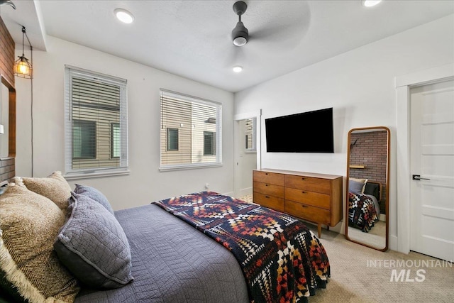 bedroom featuring light carpet, ceiling fan, baseboards, and recessed lighting