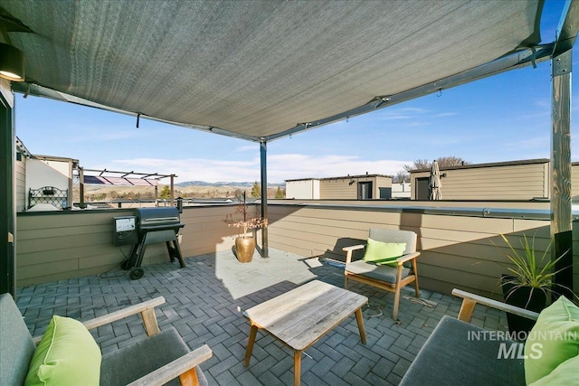 view of patio / terrace with an outdoor living space and grilling area