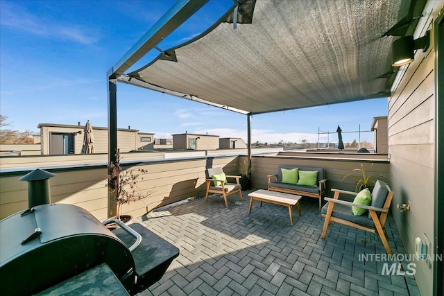 view of patio / terrace with a balcony