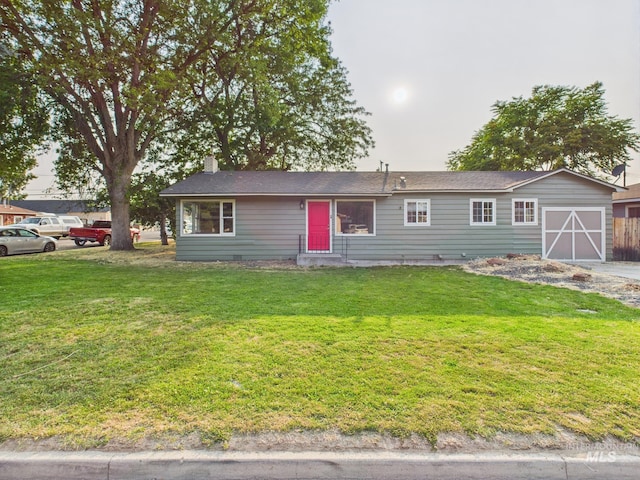 2624 Iowa Ave, Caldwell, ID 83605 - ranch-style home with an attached garage, a front yard, a chimney, and driveway