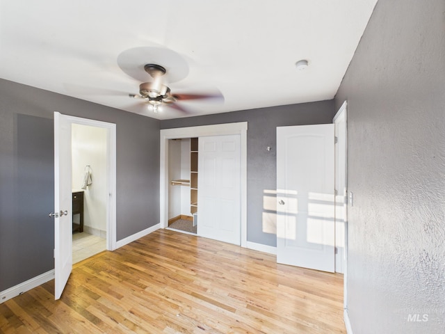 2624 Iowa Ave, Caldwell, ID 83605 - unfurnished bedroom with light wood-style floors, a closet, ensuite bathroom, and ceiling fan