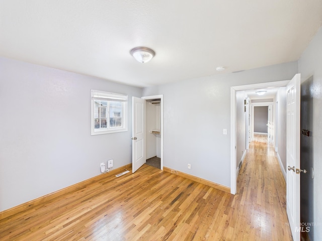2624 Iowa Ave, Caldwell, ID 83605 - unfurnished bedroom with light wood-style flooring and baseboards