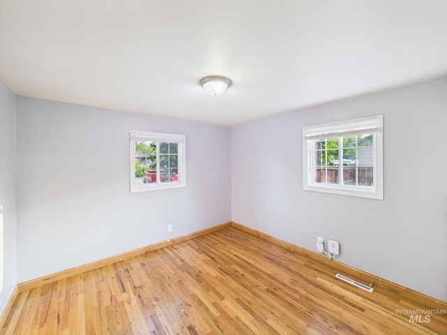 2624 Iowa Ave, Caldwell, ID 83605 - unfurnished room featuring wood finished floors and baseboards