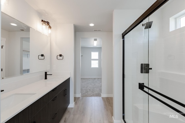 3819 W Tribute St, Meridian, ID 83642 - full bath with a stall shower, wood finished floors, healthy amount of natural light, and recessed lighting
