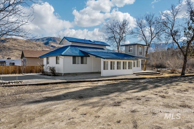 rear view of property with a mountain view