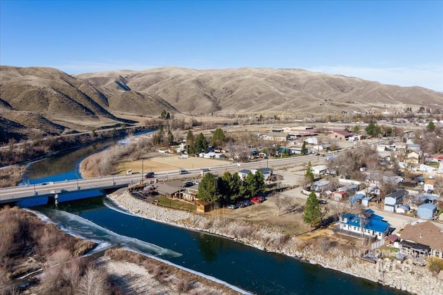 bird's eye view featuring a water and mountain view