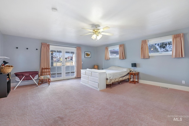 carpeted bedroom with baseboards, french doors, multiple windows, and access to exterior