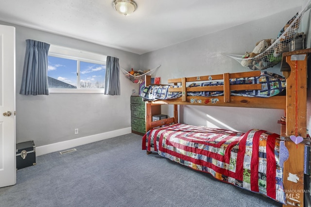 carpeted bedroom with baseboards and visible vents