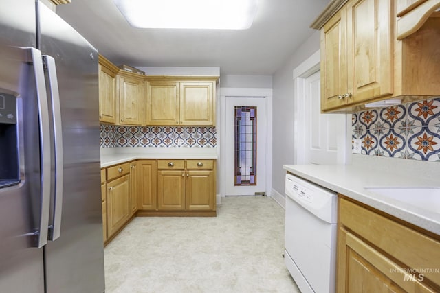 kitchen featuring light countertops, white dishwasher, backsplash, and stainless steel fridge with ice dispenser