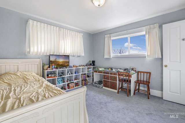 carpeted bedroom with baseboards