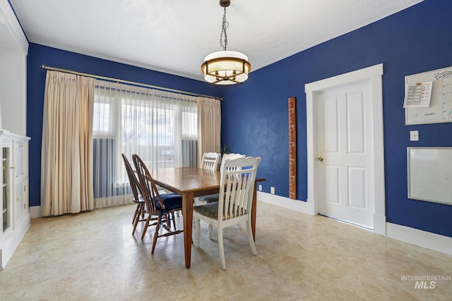 dining space with baseboards