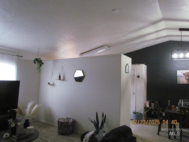 living area featuring lofted ceiling