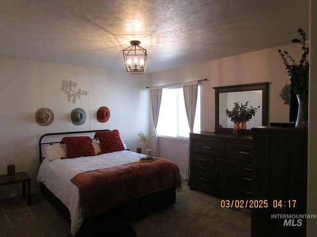 carpeted bedroom with a notable chandelier