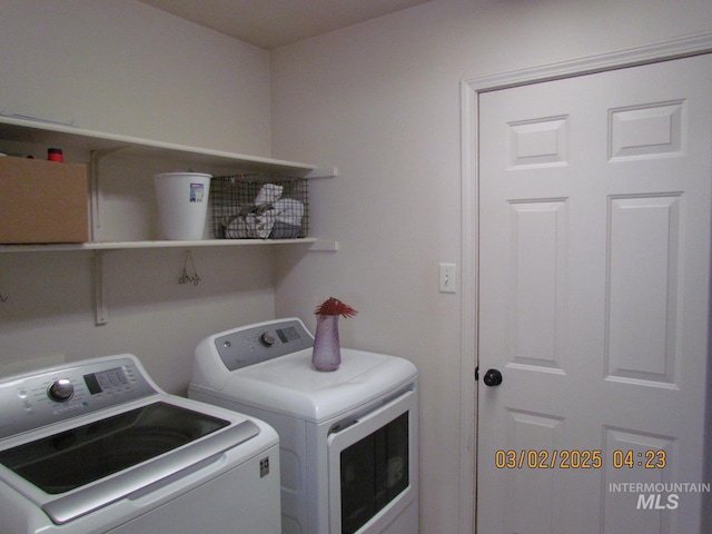 laundry room featuring washing machine and dryer and laundry area